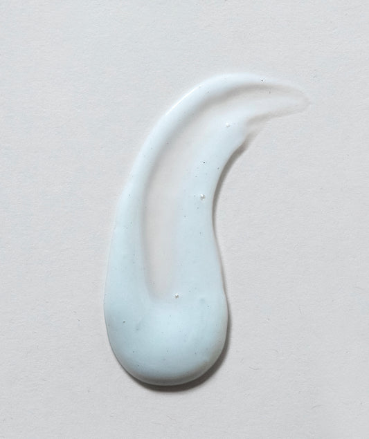 Smear of product, White with very small darker dots.